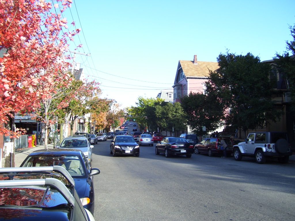 Shops and trees along Wickenden Street in autumn