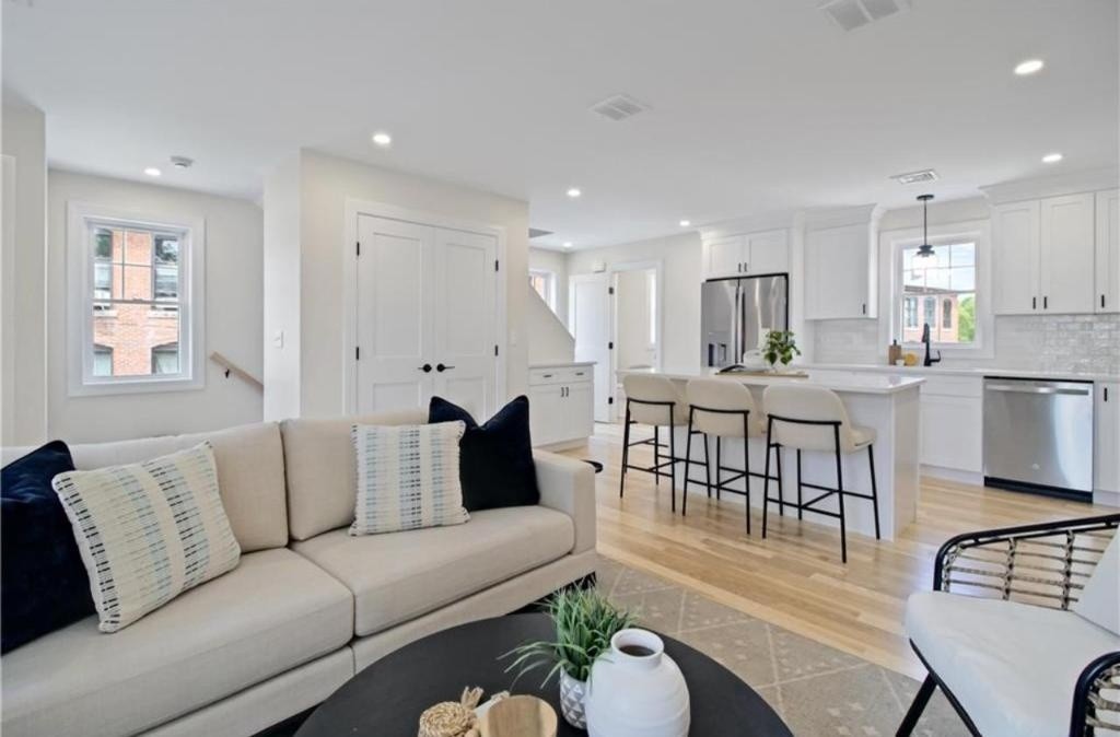 Gallery Green living room open to the kitchen